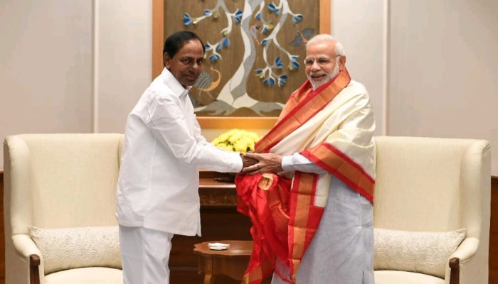 Modi,KCR pinching together
